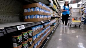 Walmart employee uses digital shelf tag, stock to light.